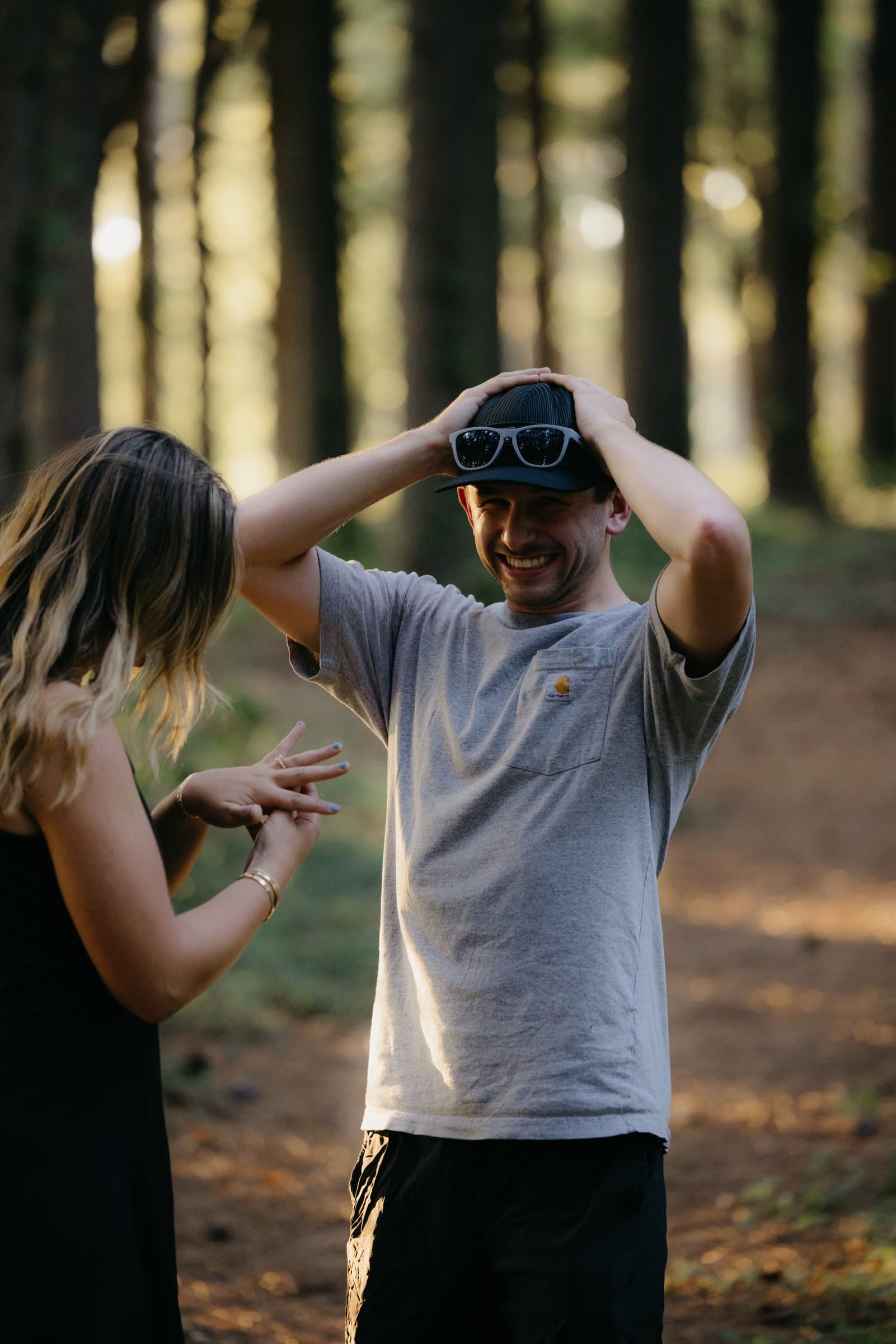 A newly engaged man, hands on his head in disbelief